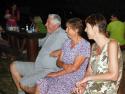 Tkanie pokrovce v prednej chyži, gazdiná sa nimi p Tkanie pokrovce v prednej chyži, gazdiná sa nimi p